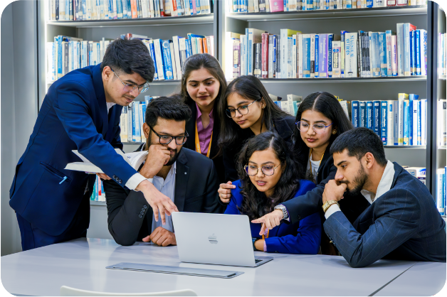 Students looking at laptop